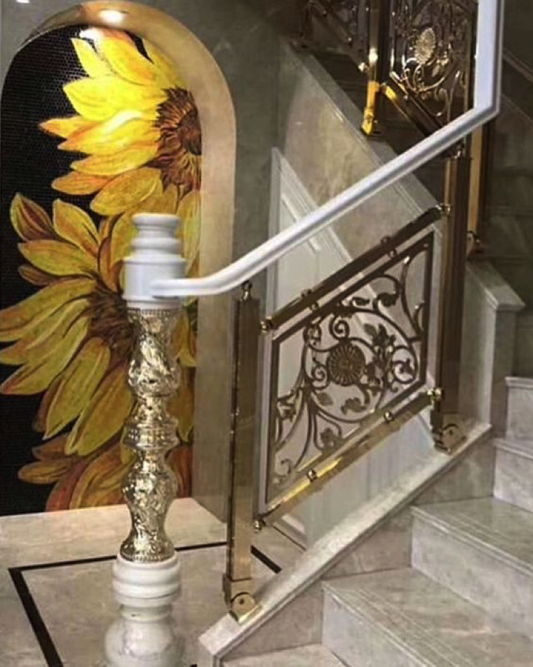 A beautiful custom mosaic artwork stands out and elevates the entrance.