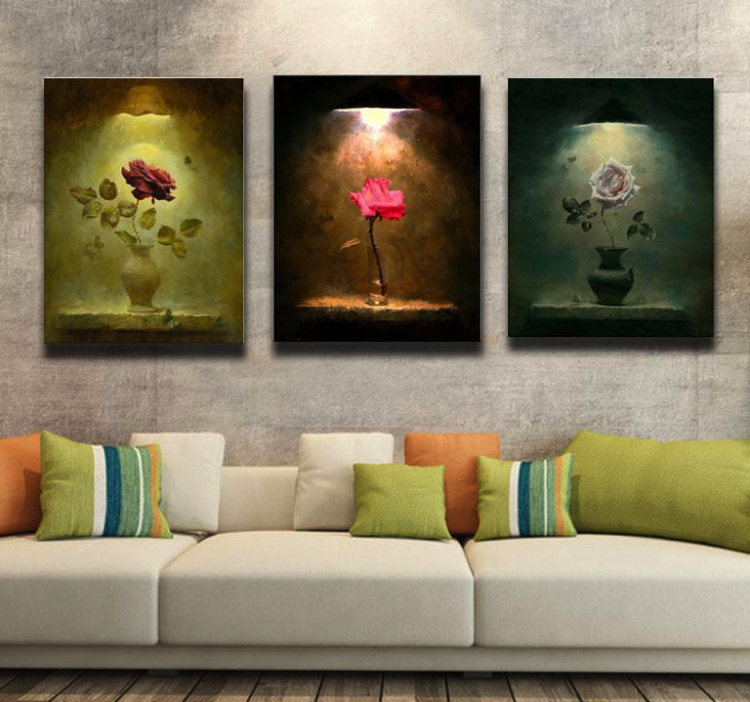 A trio of roses wall art gives the illusion of down lighting
