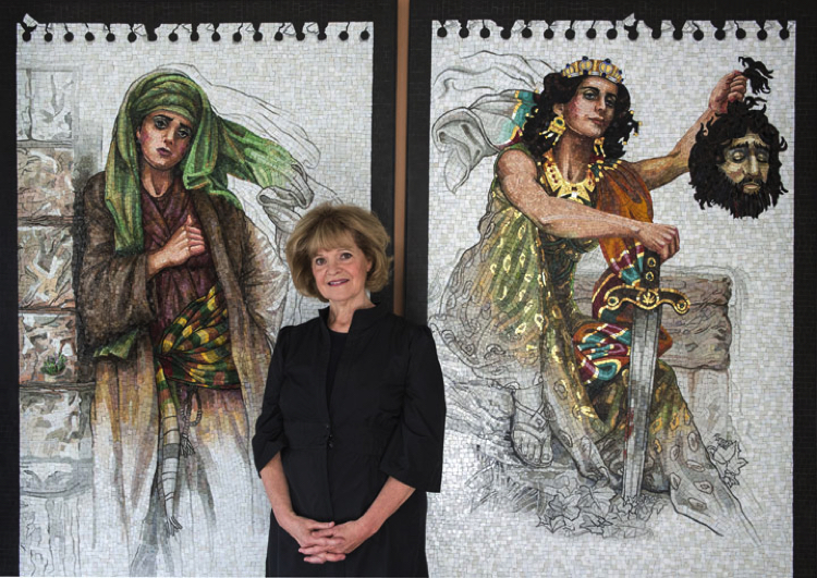 Lilian Broca stands in front of her entrancing contemporary mosaic wall art