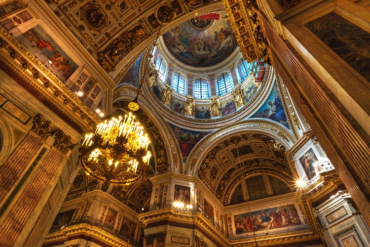 Mosaic murals and warm colours make a truly renaissance scene at St. Isaacs Cathedral, Russia.