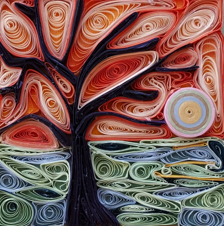 A contemporary Mosaic abstract tree holds  spiralled white wires.