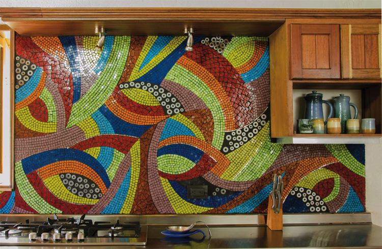 A kitchen handmade mosaic backsplash that is bold, geometric lines.