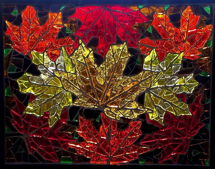 Glass mosaic design of frosty autumn leaves scattered over the streets.