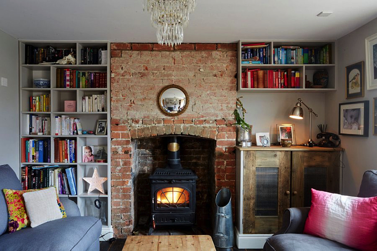 A fireplace as a focal pint in an eclectic space designed by Hart Design And Construction