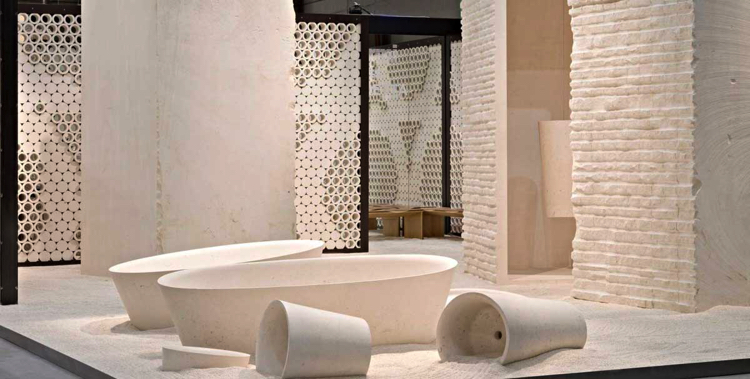 Stone tiles and contemporary vessels radiate a strange and surreal neatness onto a home interior.