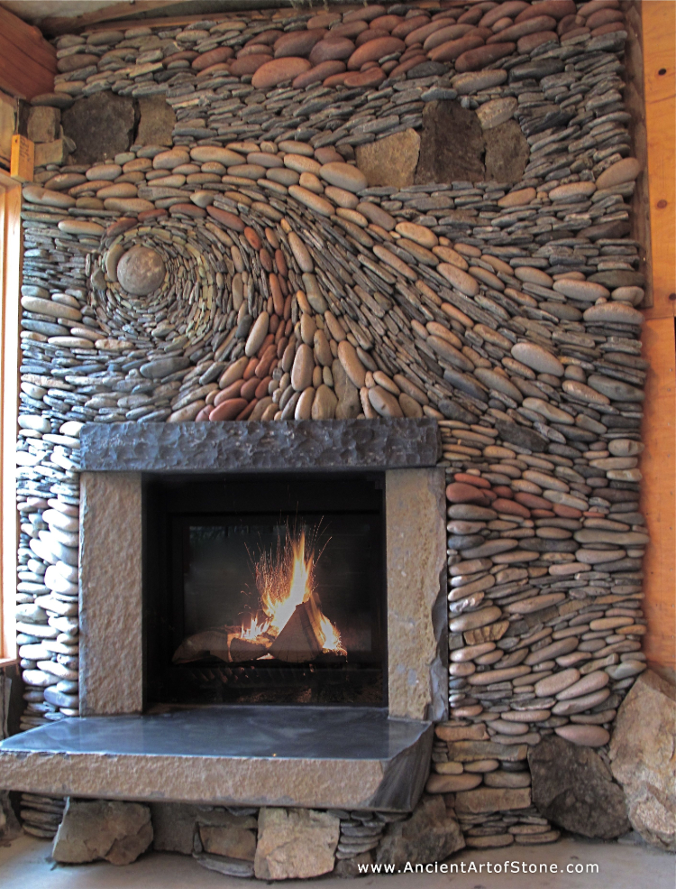 Stone mosaic artwork that adds some earthy magic to your fireplace