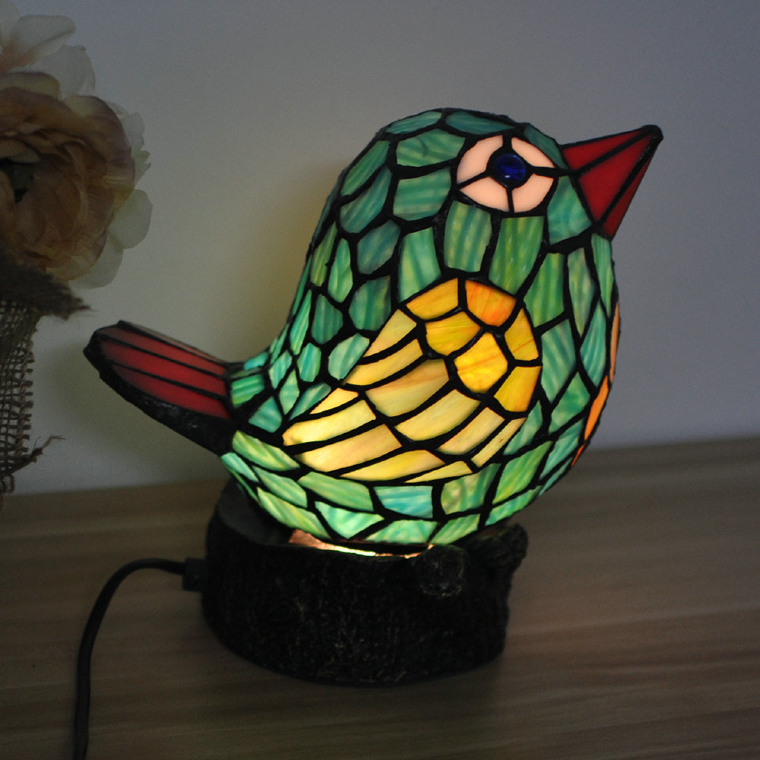 Cute glass mosaic bird with beautiful glowing effect.