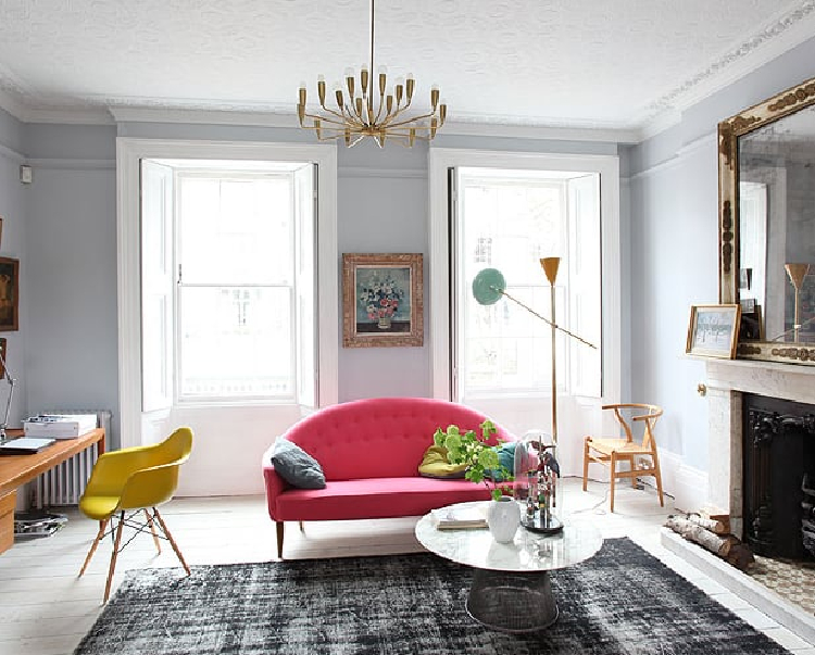 A single pink statement-making sofa.