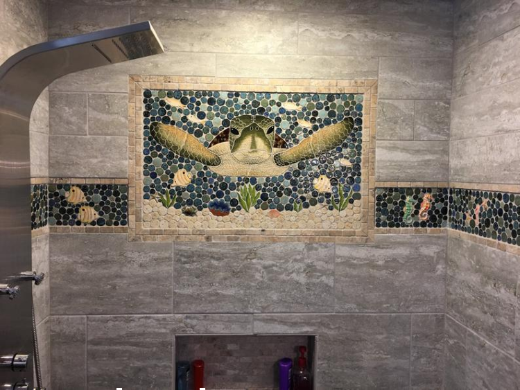 Charming sea turtle mosaic artwork makes a beautiful addition to the bathroom.
