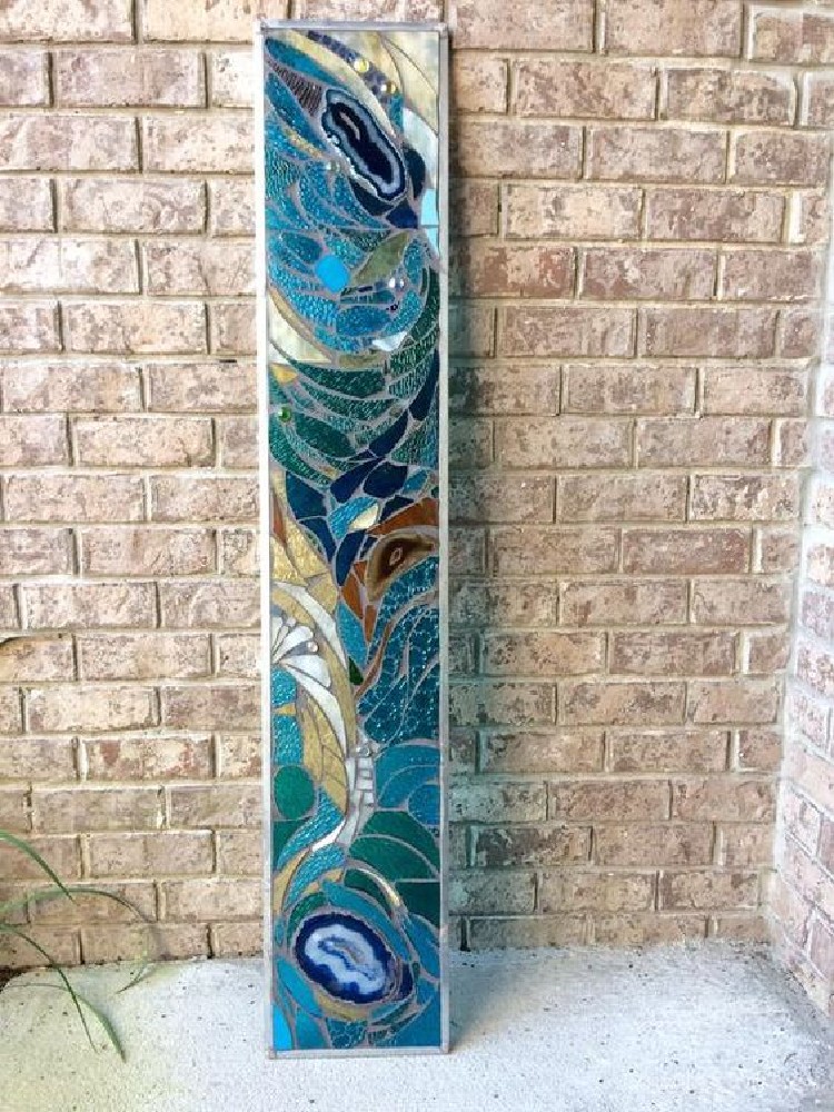 Unique glass mosaic statement piece that is perfect for your bathroom.