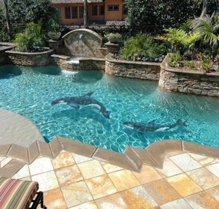 Pool mosaic artwork of orcas