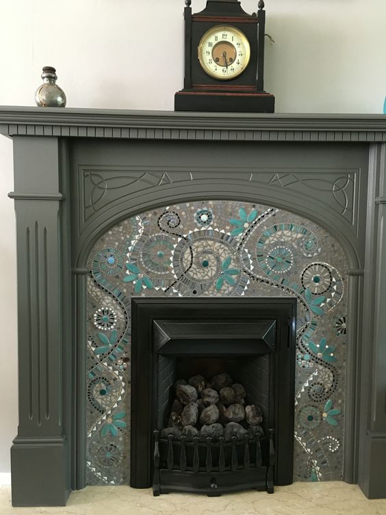 Beautiful monochromatic fireplace mosaic design. 